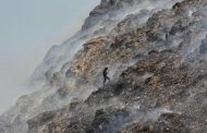 A trash heap 62 meters high shows the scale of India's climate challenge